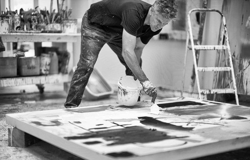 black and white photo of Nick painting