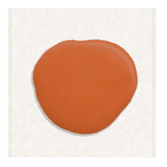 Orange irregular circular shape on a light textured background.